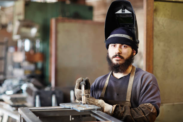 istock Serious bearded welder in helmet 912319358
