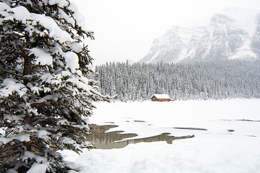 Boat house on Lake Louise shoreline. The ice is quite thick and safe in January.