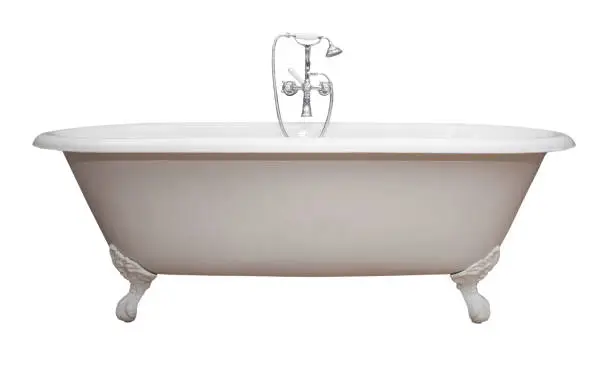 Beautiful classic style white claw foot bathtub with stainless steel old fashioned faucet and sprayer. Isolated on white.