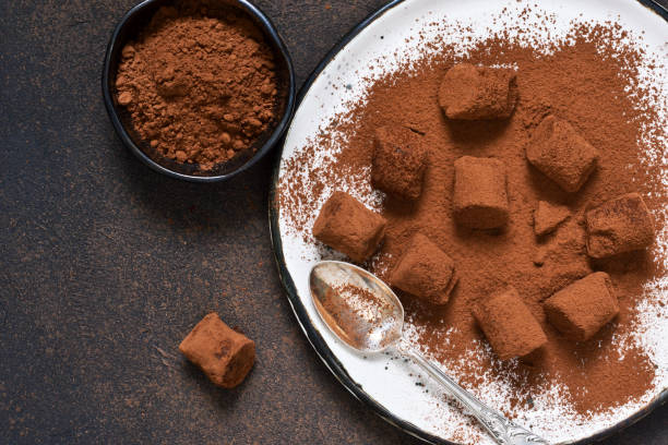 istock Chocolate truffle with avocado and cocoa powder on a brown background. 912325804