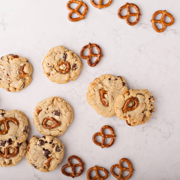 istock Chocolate chips and pretzels cookies on a marble table 912326498