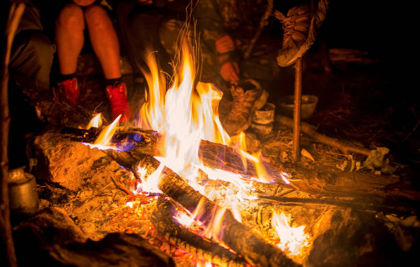 istock tourists around the campfire at night heated and dried things 912326514