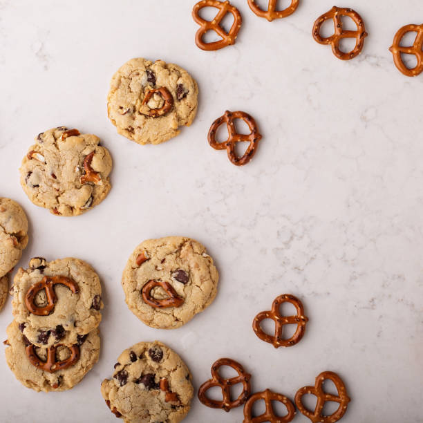 istock Chocolate chips and pretzels cookies on a marble table 912326796