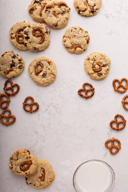 istock Chocolate chips and pretzels cookies on a marble table 912326898