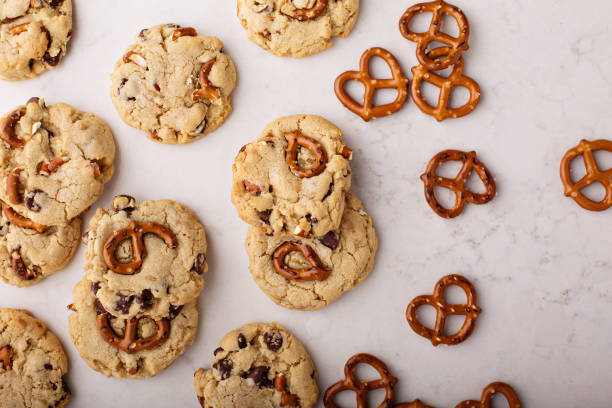 istock Chocolate chips and pretzels cookies on a marble table 912326962