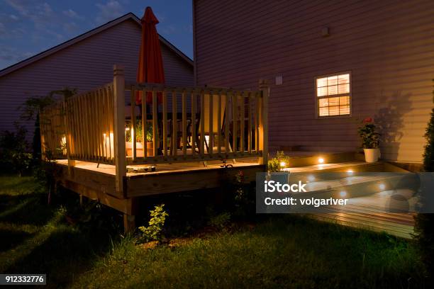 Wooden Deck And Patio Of Family Home At Night Stock Photo - Download Image Now - Lighting Equipment, Outdoors, Deck