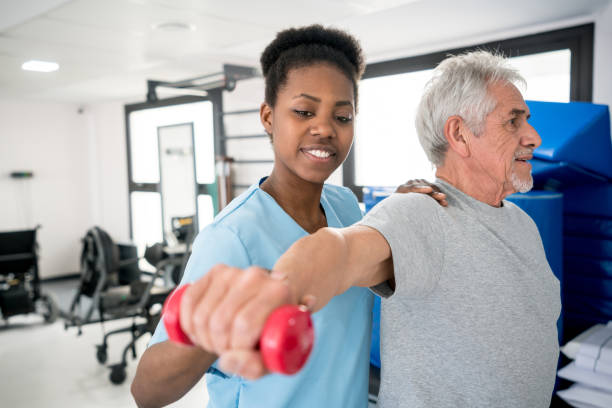 istock African american occupational therapist helping a senior patient with his shoulder workout 912333730