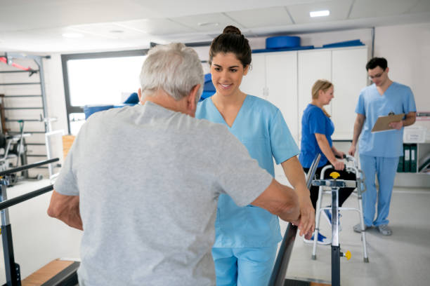 istock Patients at occupational therapy each one with a therapist 912334154
