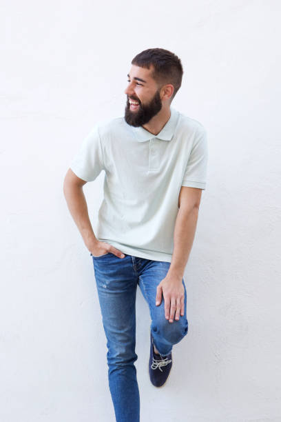 istock Happy friendly man standing isolated on white wall 912334288