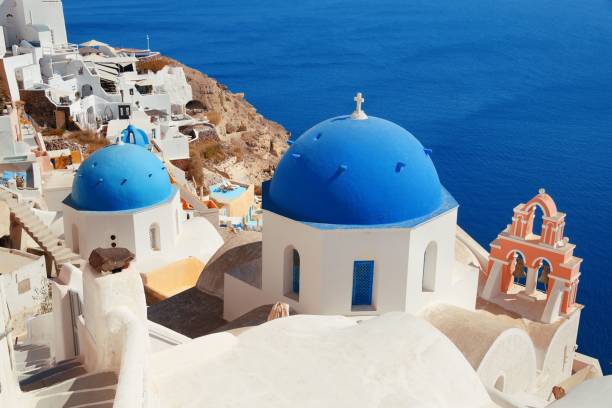 istock Santorini skyline blue church 912334626