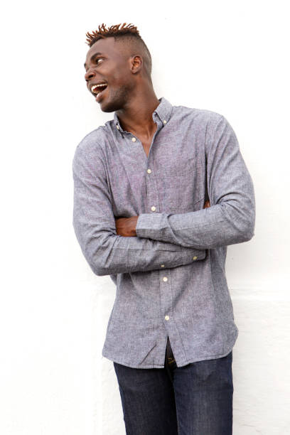 istock Black guy looking away and smiling over white background 912334724