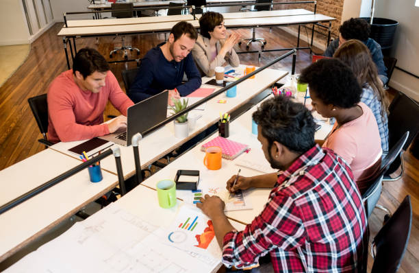 istock Group of people working online at a creative office 912334832