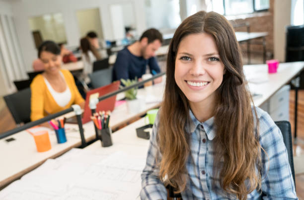 istock Happy woman working at a creative office 912335008