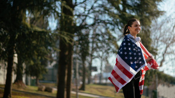 istock Woman athete with American flag 912338126