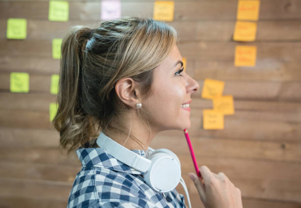 istock Thoughtful woman brainstorming at a creative office 912338218