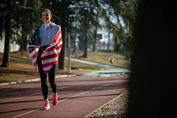 istock US athlete with American flag 912341018