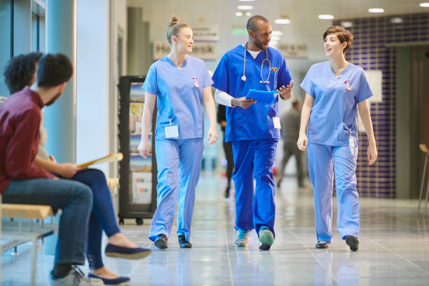 istock nurses chatting on the way to ward 912341044