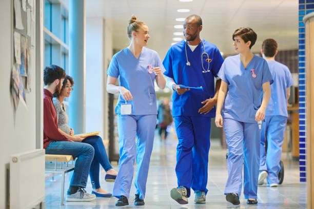 istock nurses chatting on the way to ward 912341124