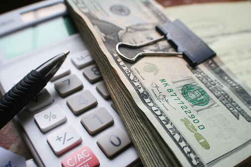 Monthly Bills With Calculator & Twenties Ready To Pay Bills