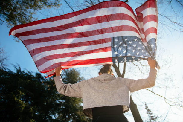 istock Young female athlete with an American flag 912342678