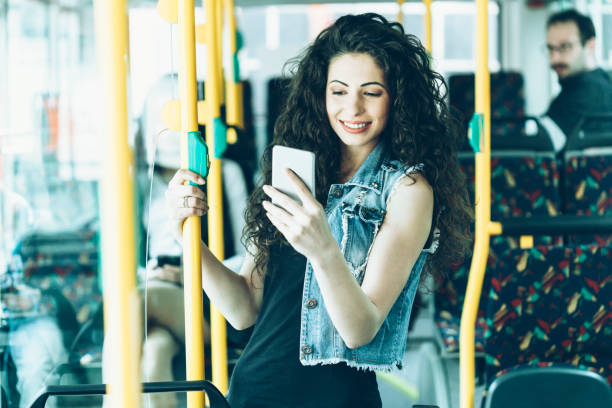 istock Young woman taking selfie in public transport 912344970