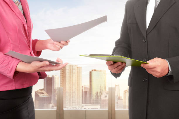 istock Business people with files discussing something 912345796