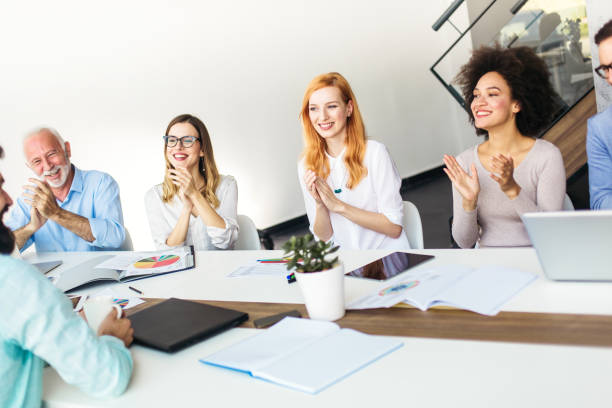 istock Group of business people applauding 912345938