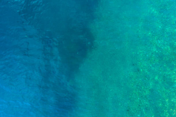 istock Aerial view on turquoise waves, water surface texture 912348870