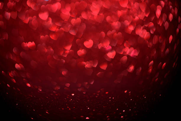istock Red Blur heart shape of ligth bokeh on a black background 912349114