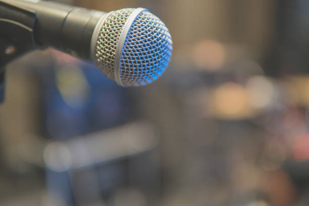 istock Blurred background of microphone on stage  in the conference hall 912349280