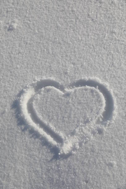 istock Heart symbol on snow background 912349424