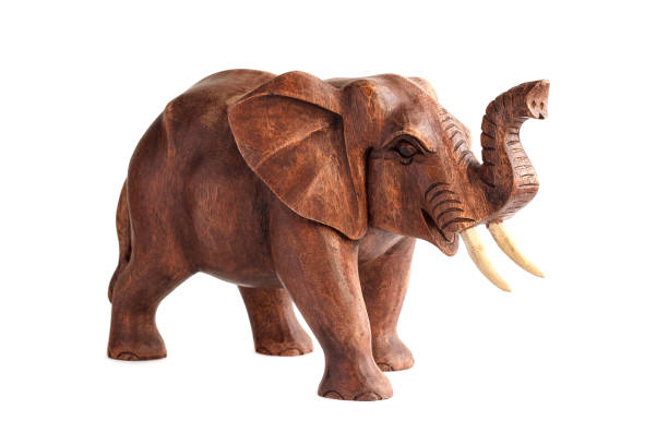 istock Carved wood elephant figure. Isolated 912352564