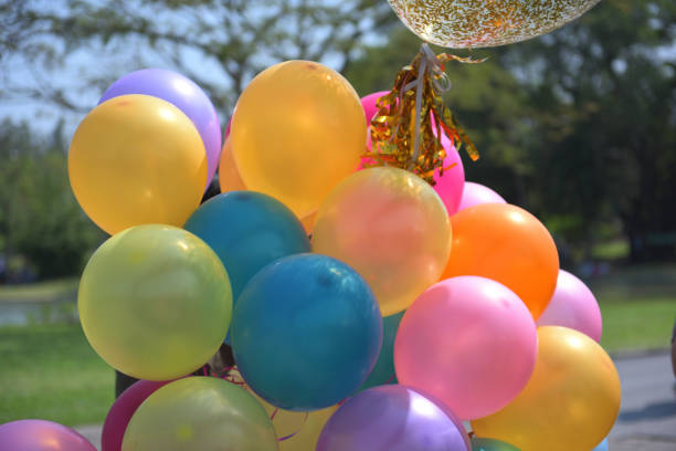 istock Colorful balloons with celebration and various party confetti 912352818