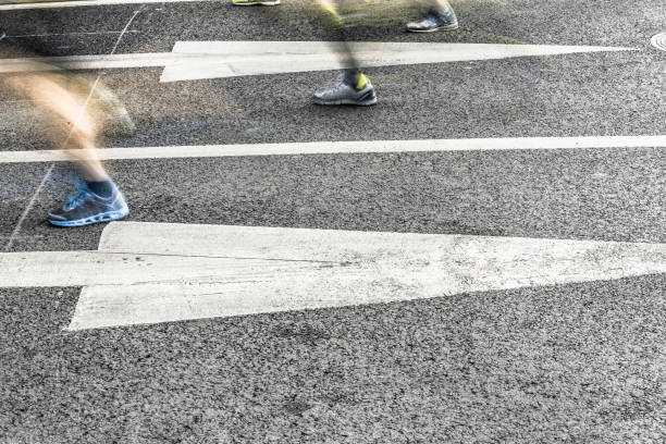 istock People running in marathon on city streets. Motion blur. 912353696