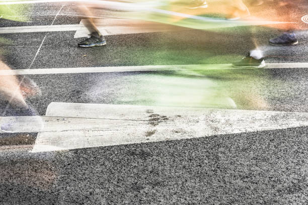 istock People running in marathon on city streets. Motion blur. 912353728