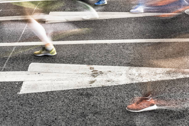 istock People running in marathon on city streets. Motion blur. 912353744
