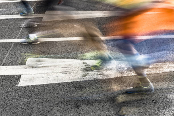 istock People running in marathon on city streets. Motion blur. 912353748