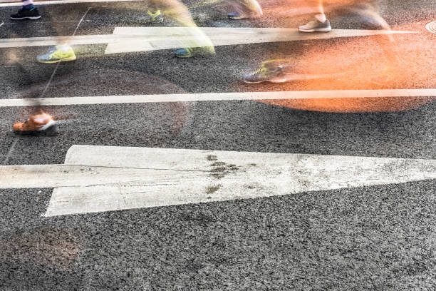 istock People running in marathon on city streets. Motion blur. 912353752