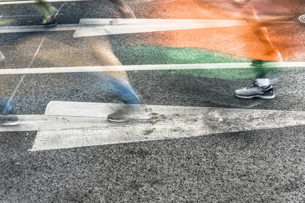 istock People running in marathon on city streets. Motion blur. 912353790