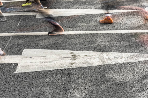 istock People running in marathon on city streets. Motion blur. 912353832
