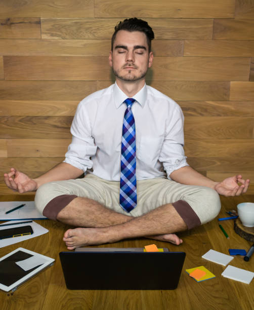 istock Calm young man in funny clothes sits on the floor 912356060