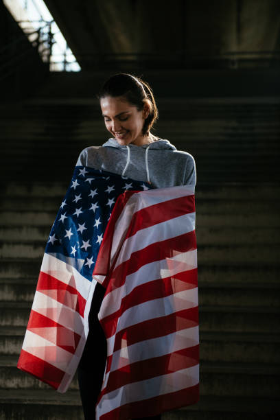 istock US athlete with American flag 912359112