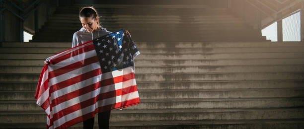 istock US athlete with American flag 912360256