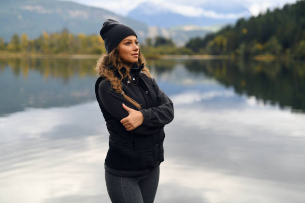 istock Young woman enjoying lake and mountain view 912373392