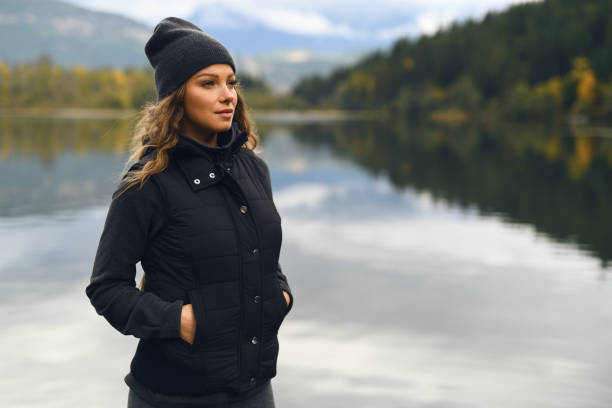 istock Young woman enjoying lake and mountain view 912373534