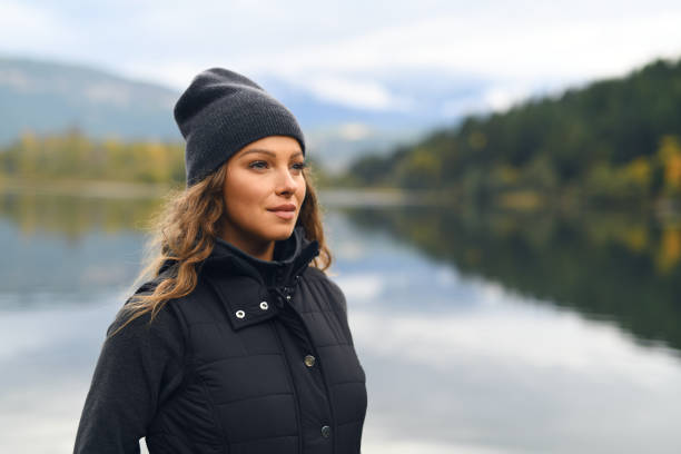 istock Young woman enjoying lake and mountain view 912373560