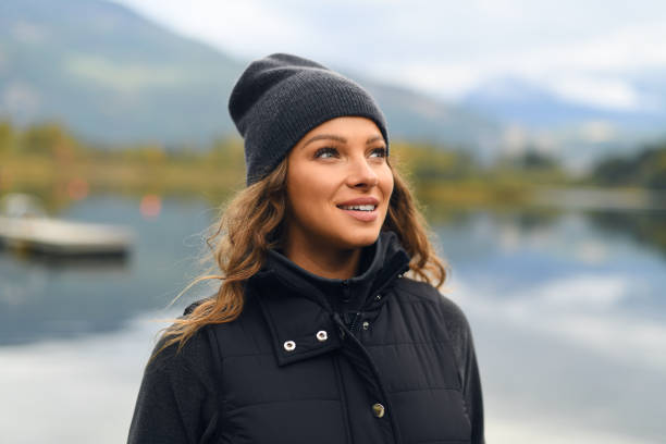 istock Young woman enjoying lake and mountain view 912373638