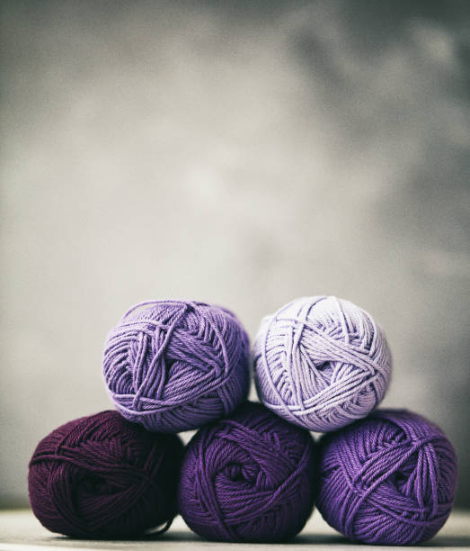 Ultra violet still life. Yarn stack in various shades of purple