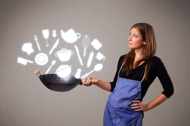 istock Young woman with kitchen accessories icons 912381986