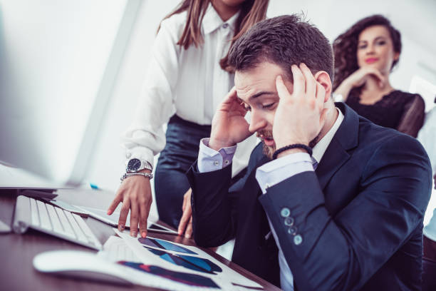 istock Stressful Businessman with Headache Feeling Sick From Work in Office 912384344